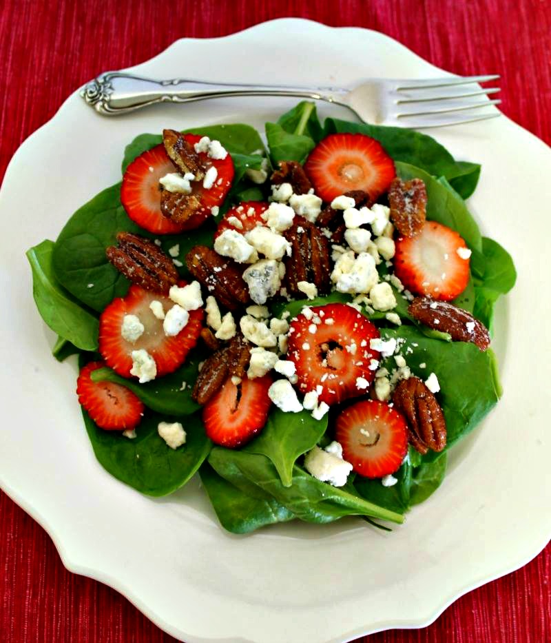 Make a fresh summer salad with spinach, strawberries, pecans, blue cheese and a delicious vinaigrette. Perfect for summer meals and BBQs. 