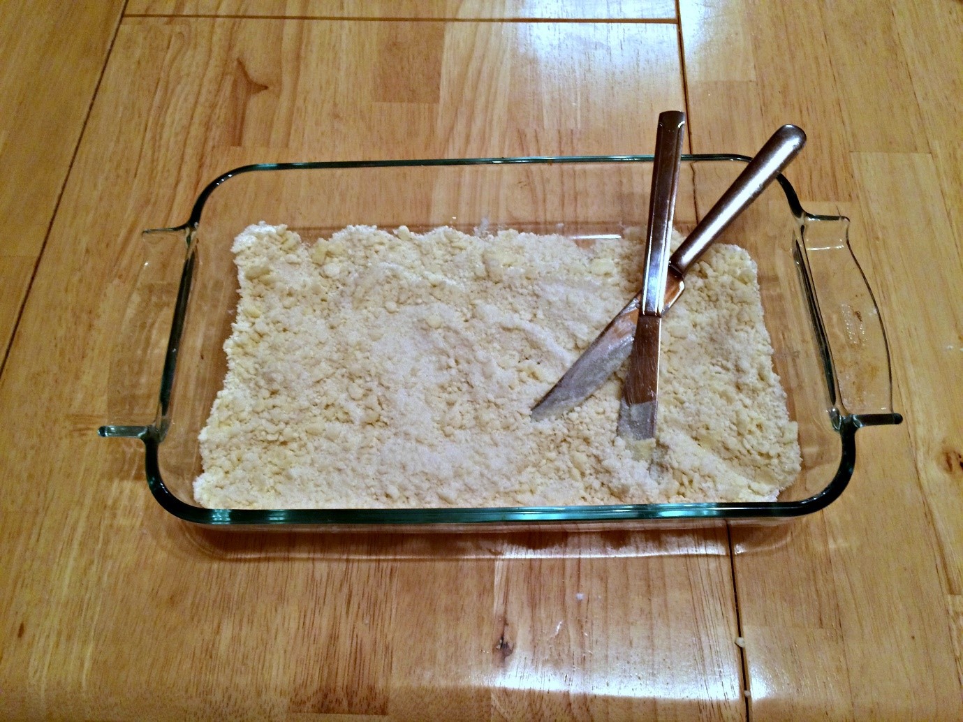 Making the streusel topping by cutting it in with two knives