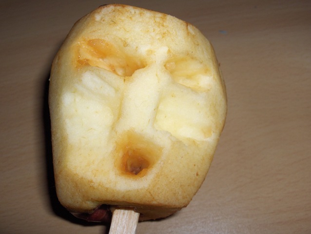 carving an apple head doll